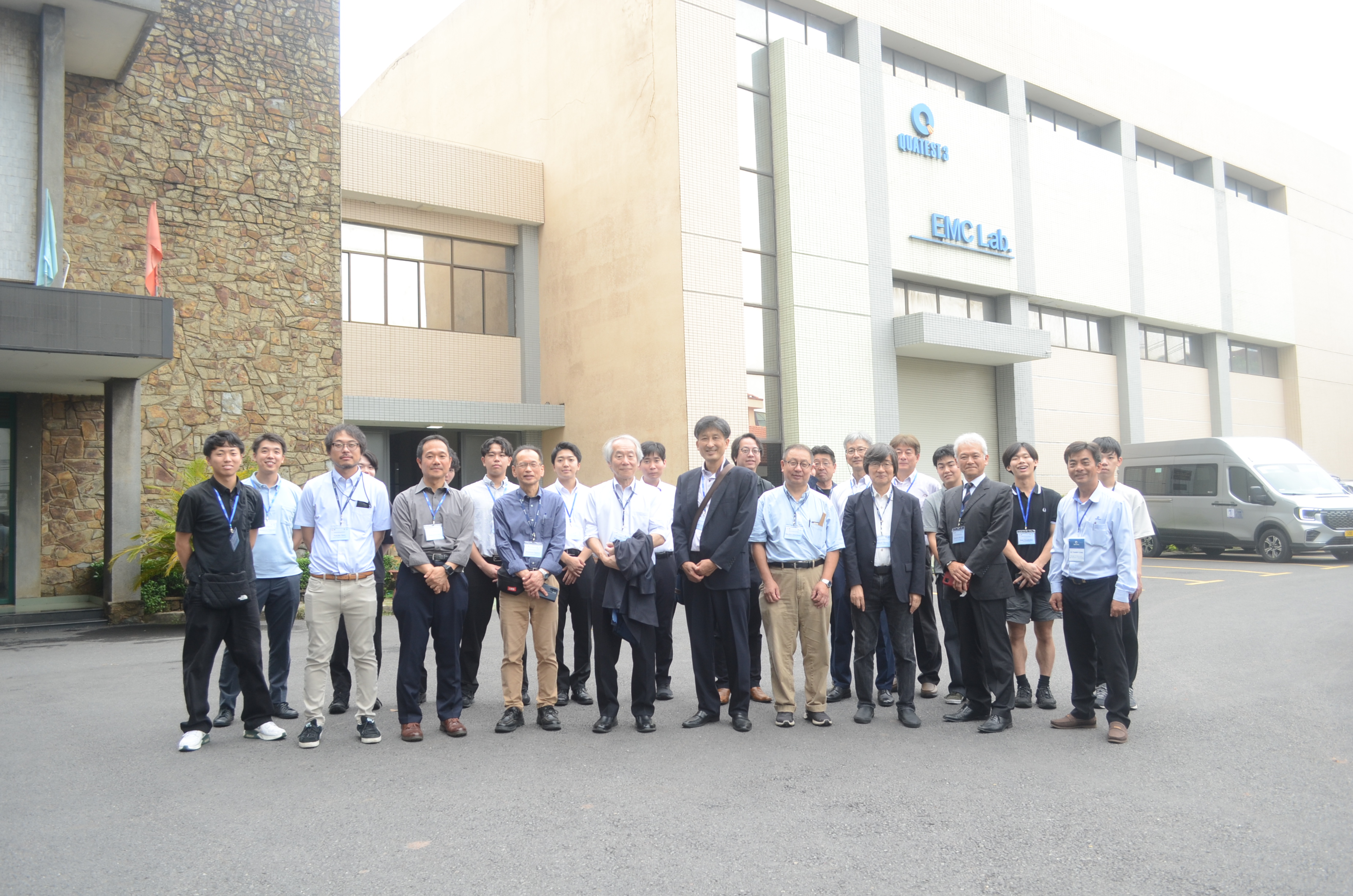 A group of people standing in front of a buildingAI-generated content may be incorrect.